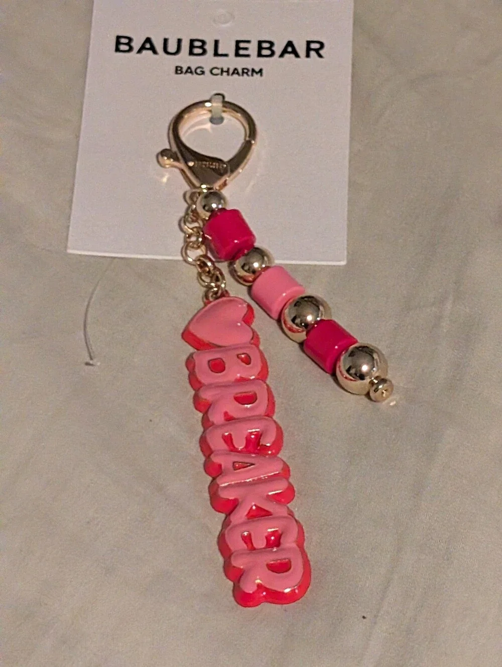 BaubleBar Pink Logo Bag Charm Keychain